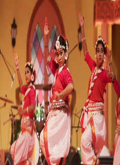 Artistes perform at a grand show to mark Durga Puja celebrations