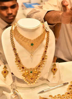 Gold loses sheen, down Rs 80 on weak trend overseas