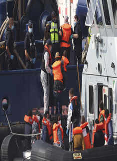 Migrants cross Channel in dinghies to England