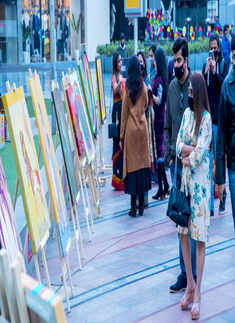 Art lovers attend an exhibition at Cyber Hub