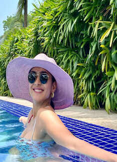 Mrunal Thakur ups the glam quotient in an olive green plunging neckline