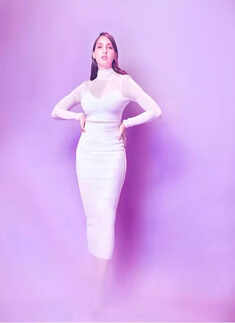 Nora Fatehi shares stunning pictures in bright yellow bodycon from her Toronto vacations