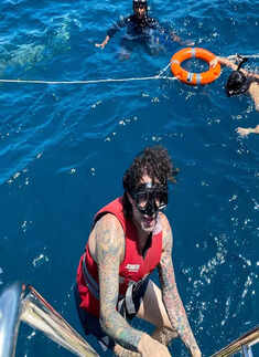 Glamorous pictures of Sunny Leone in a colourful thigh-high slit beachwear will make your heart skip a beat!