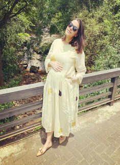 Swimsuit-clad Neha Dhupia flaunts her baby bump in these new pool pictures