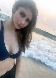 These breathtaking pictures of Mouni Roy in an off-shoulder crop top and short skirt will make you crave for seaside vacation