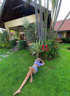 Janhvi Kapoor flaunts her toned midriff in a blue slit dress in these captivating pictures