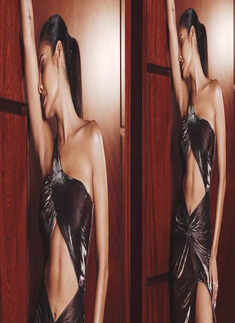 Esha Gupta is raising temperatures with her new pictures in a cut-out gown