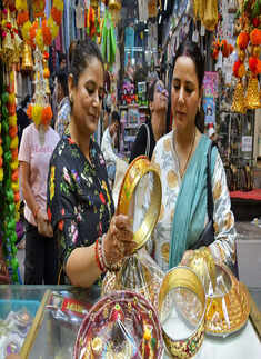 Ghaziabad: Women shop ahead of the upcoming festival of 'Karwa Chauth', at a mar...