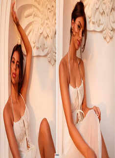 Suhana Khan shares sun-kissed pictures in white halter-neck spaghetti strap dress