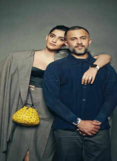 Sonam Kapoor puts an elegant twist to boardroom fashion as she poses with Anand Ahuja