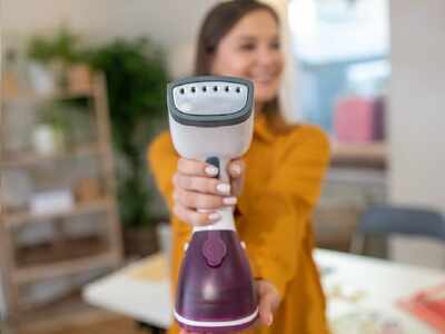 using a steamer to iron clothes