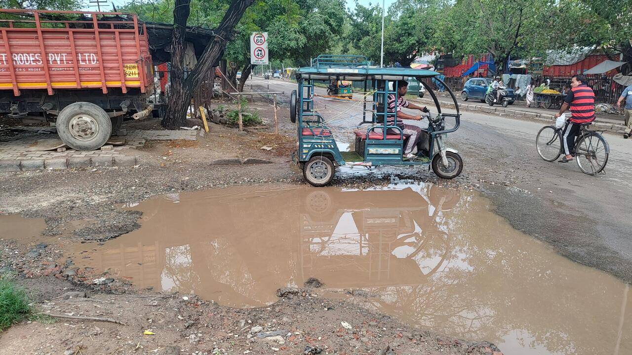 Stagnant water camouflages potholes on city roads, residents demand repairs
